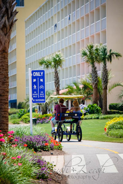 bike riders on boardwalk