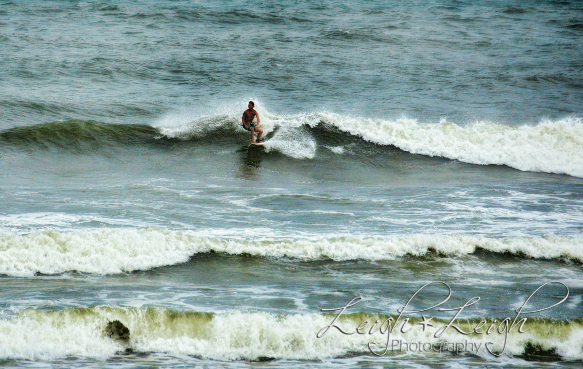 surfers in stormy ocean