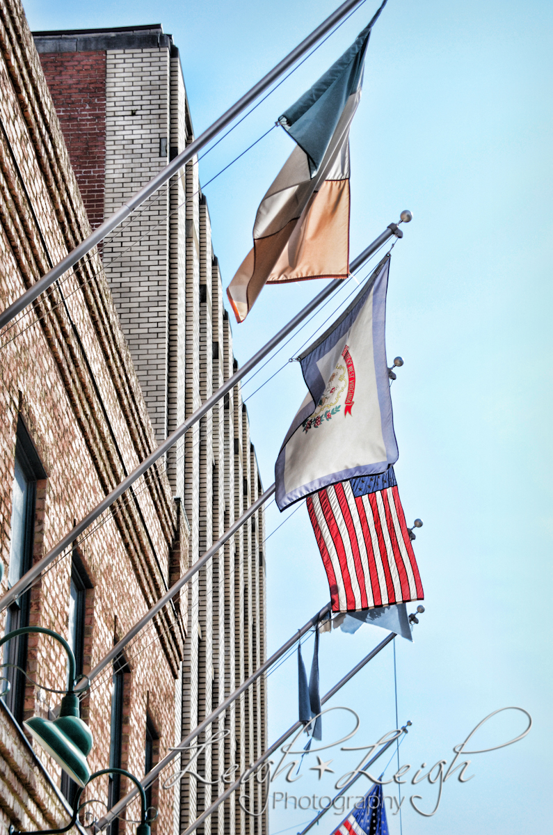 flags hanging on building