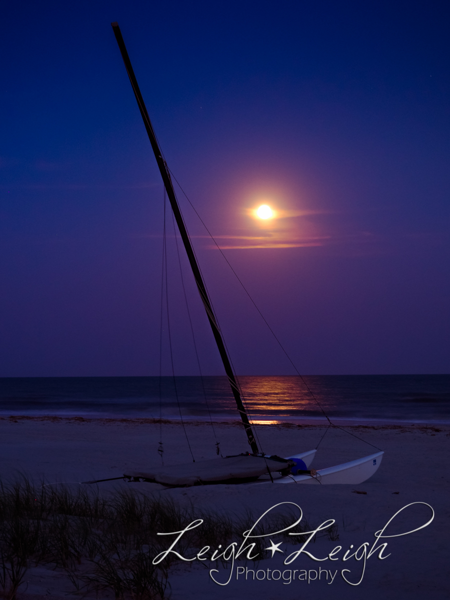 beach at night with boat