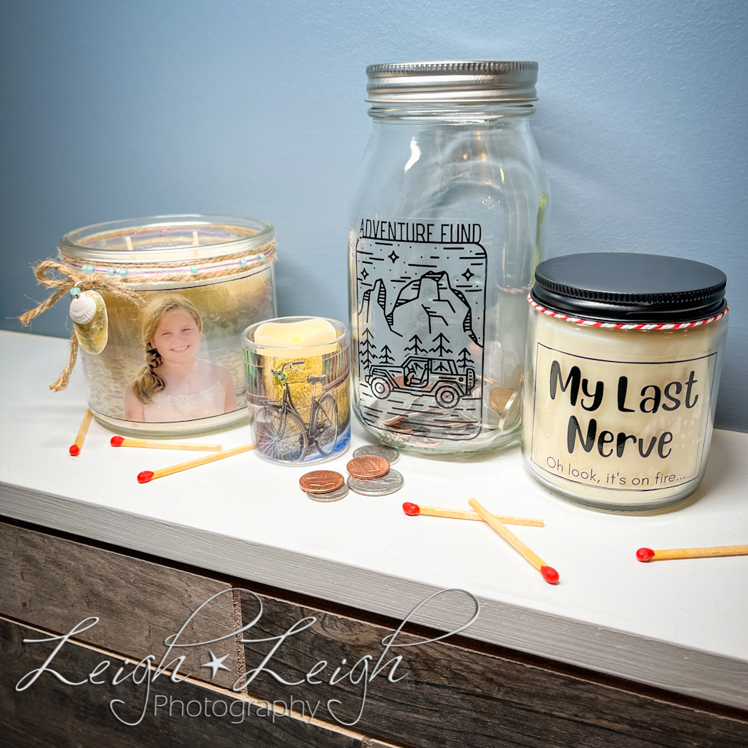 ledge with custom candles, a mason jar, and matches sitting on it.