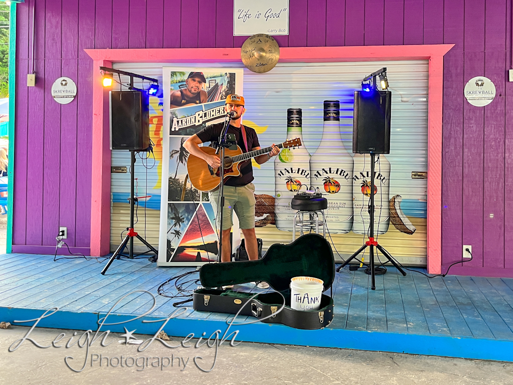 man playing music on stage