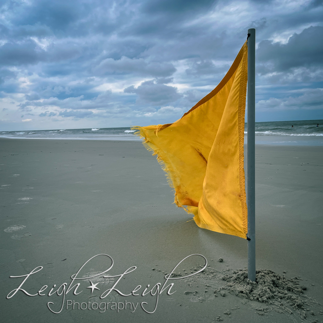 yellow flag on beach