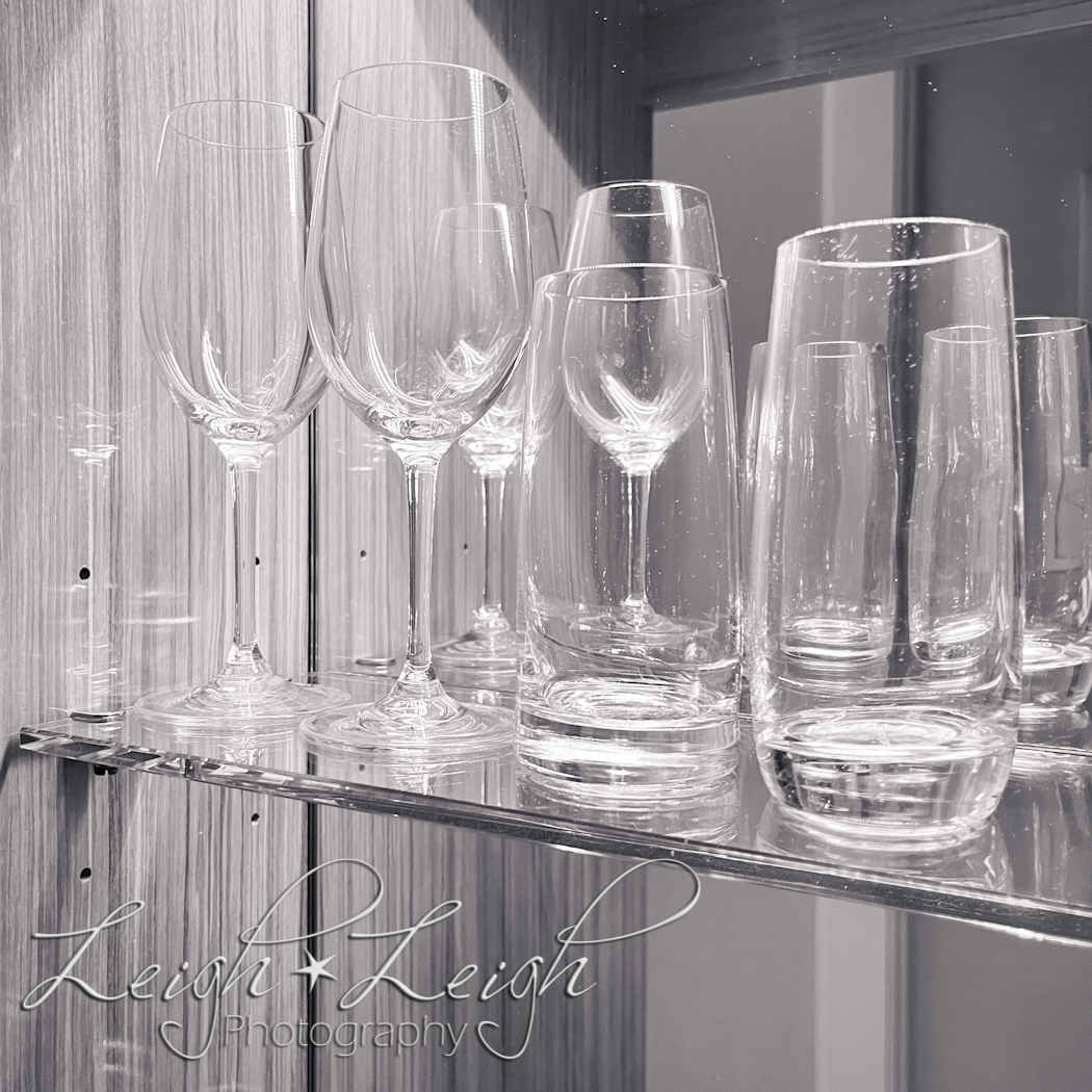 wine glasses on shelf in room