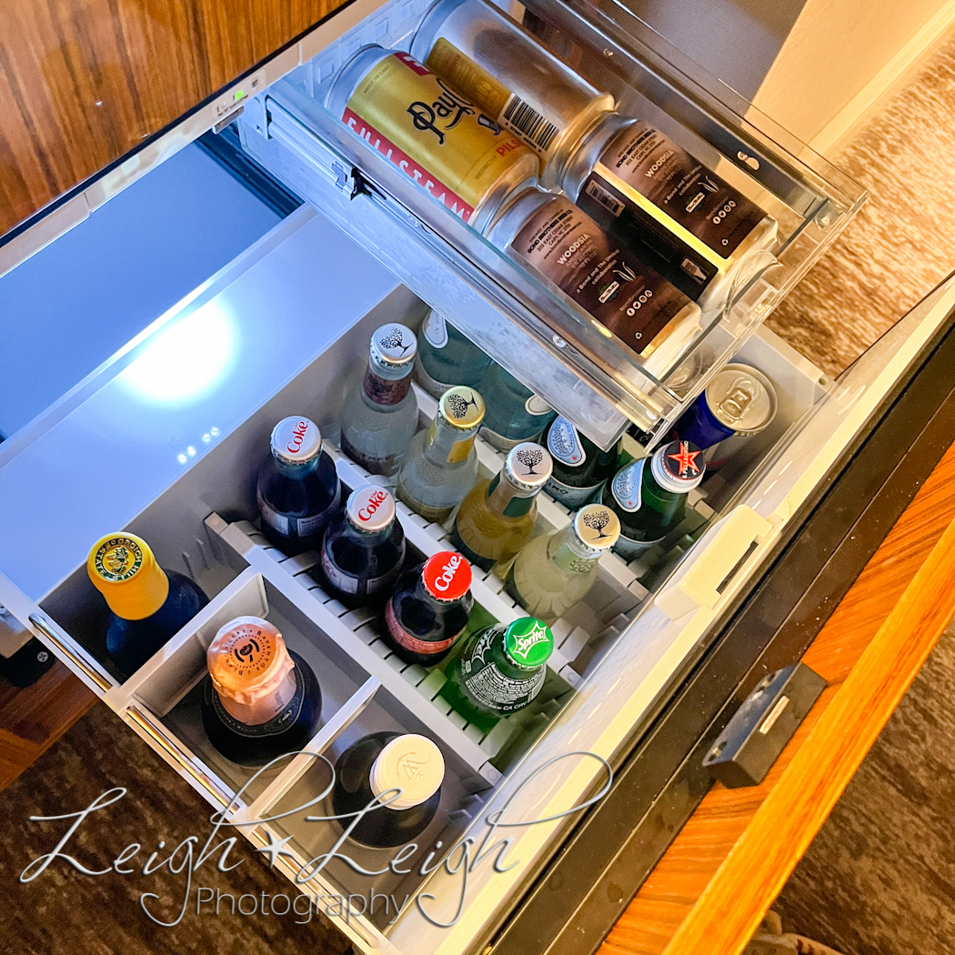 mini bar drawer/fridge of soda and drinks