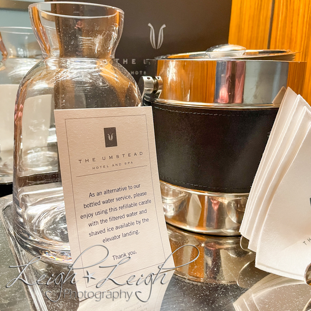 carafe in room with note to enjoy the ice and water station located in the hall 