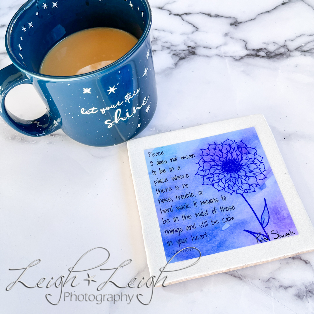 cup of coffee next to a photo coaster