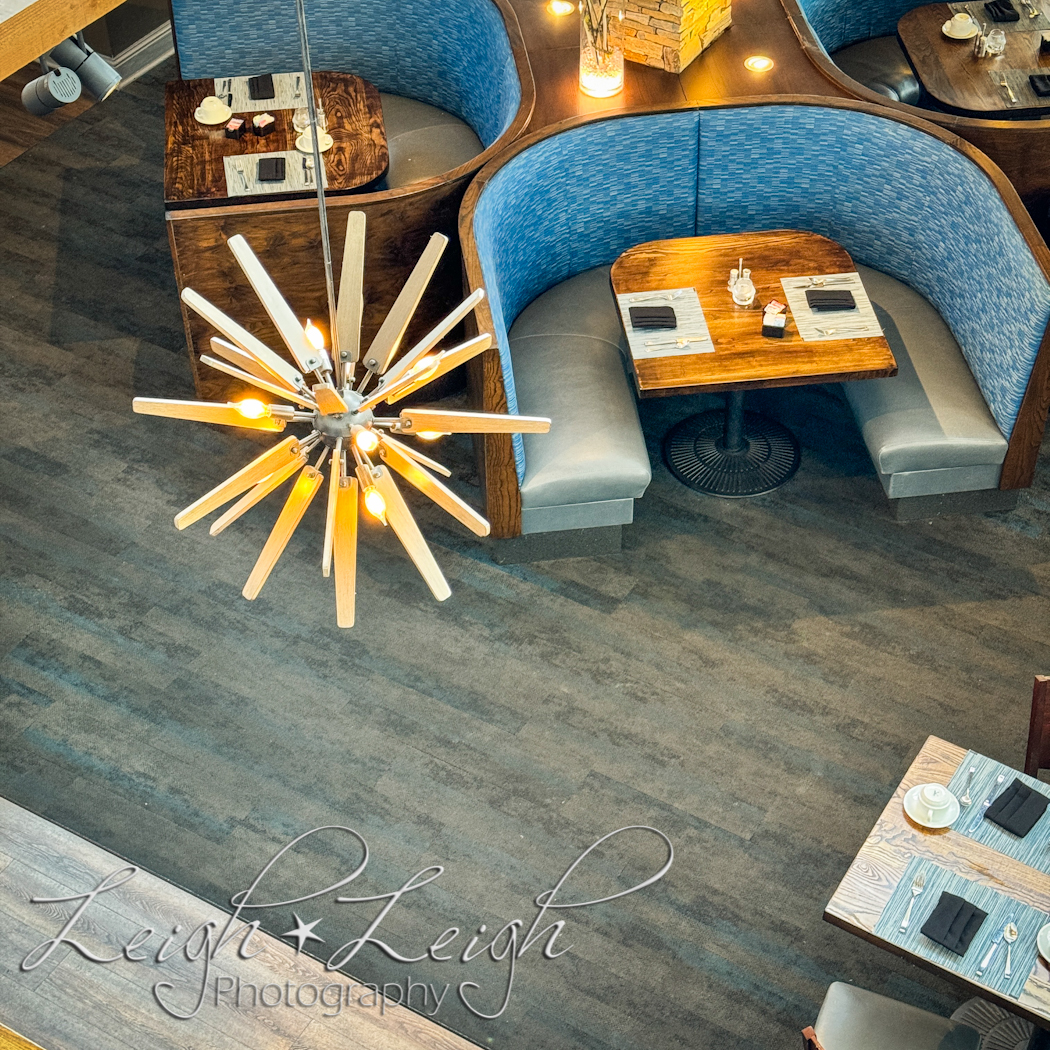 Dining area with booth and cool light fixture