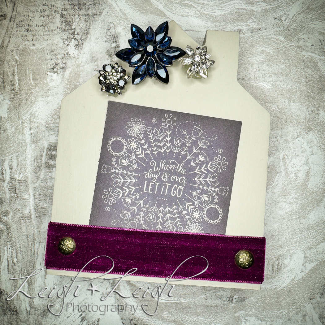 Wooden house plaque with a ribbon photo pocket and fancy buttons for decoration