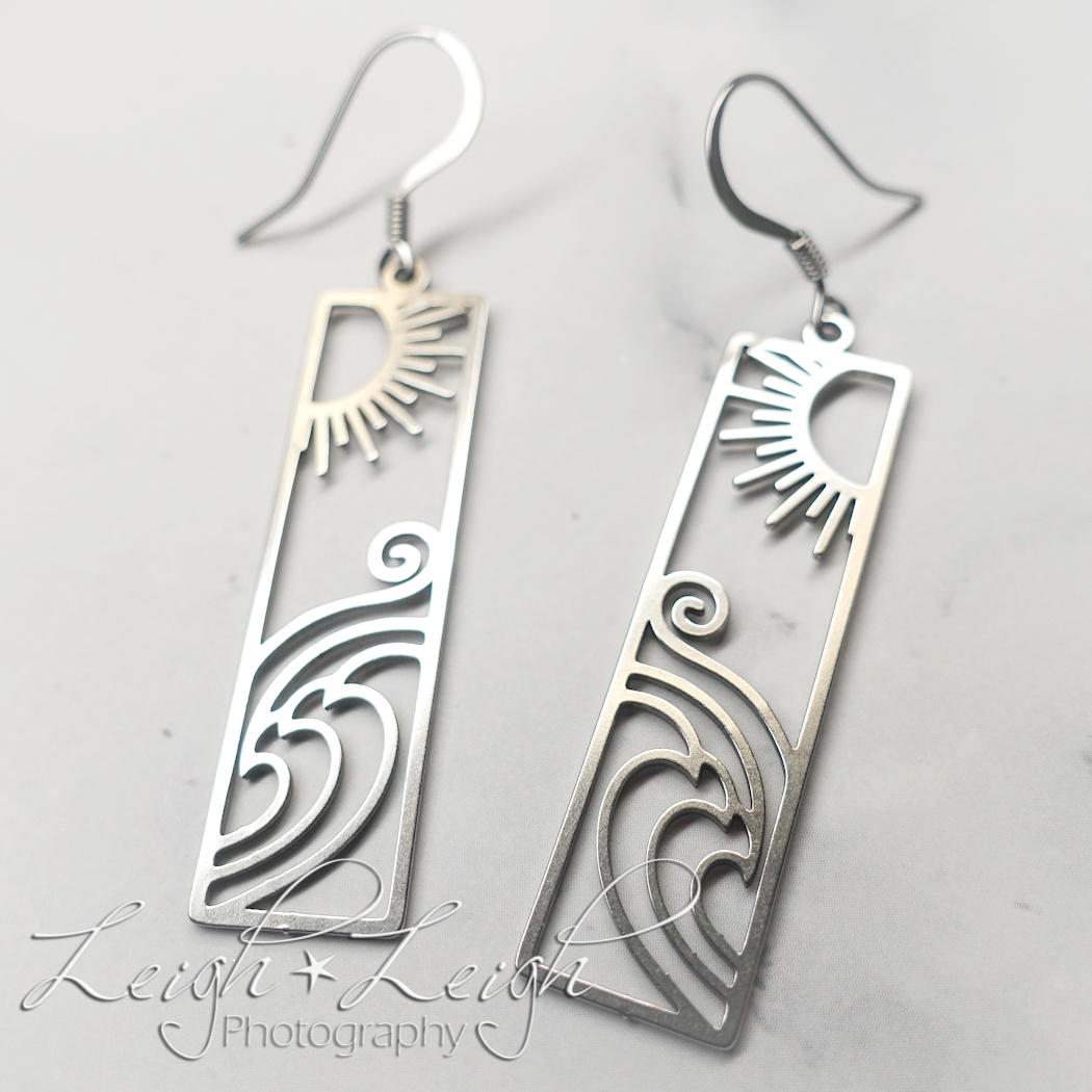 cutout design bar earrings with ocean scene