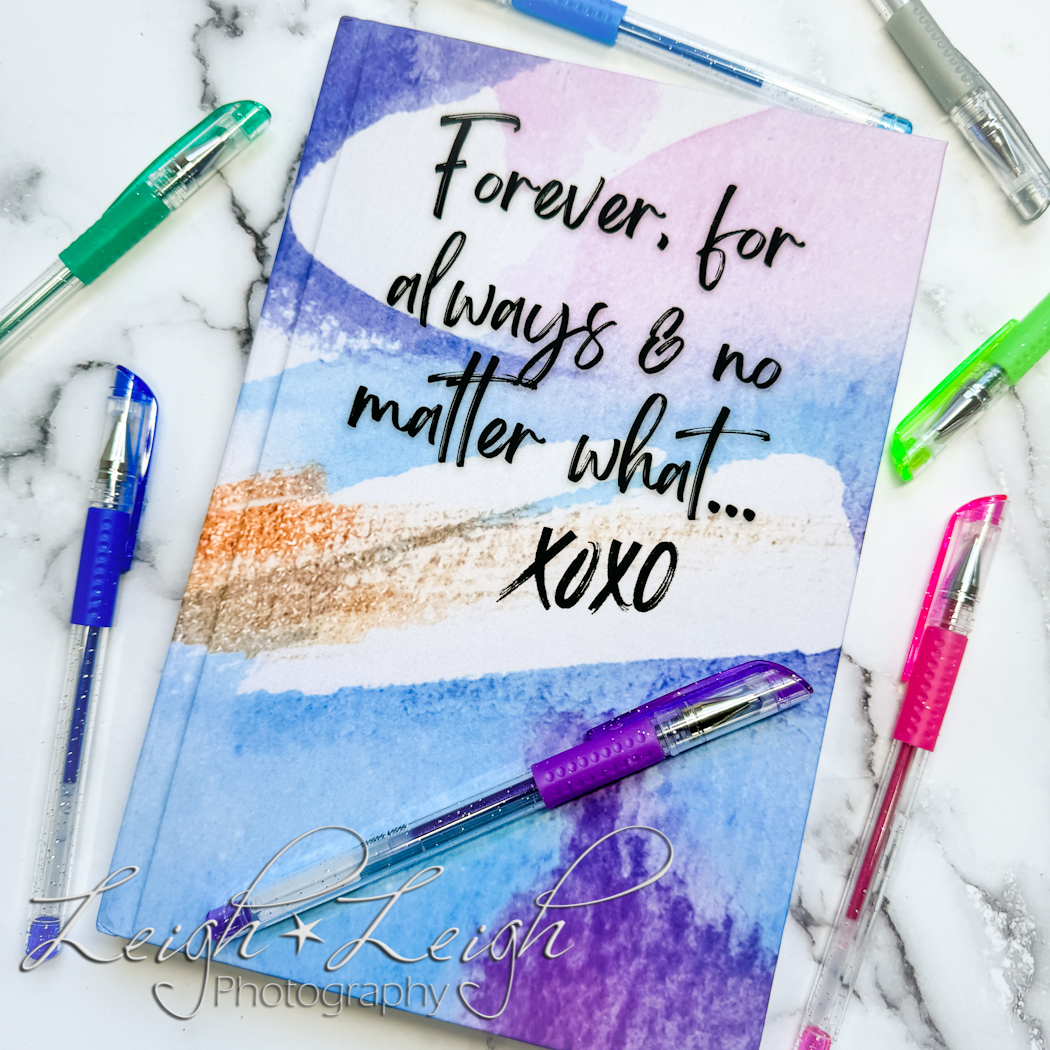 journal that reads: forever, for always and no matter what... on counter with pens around it