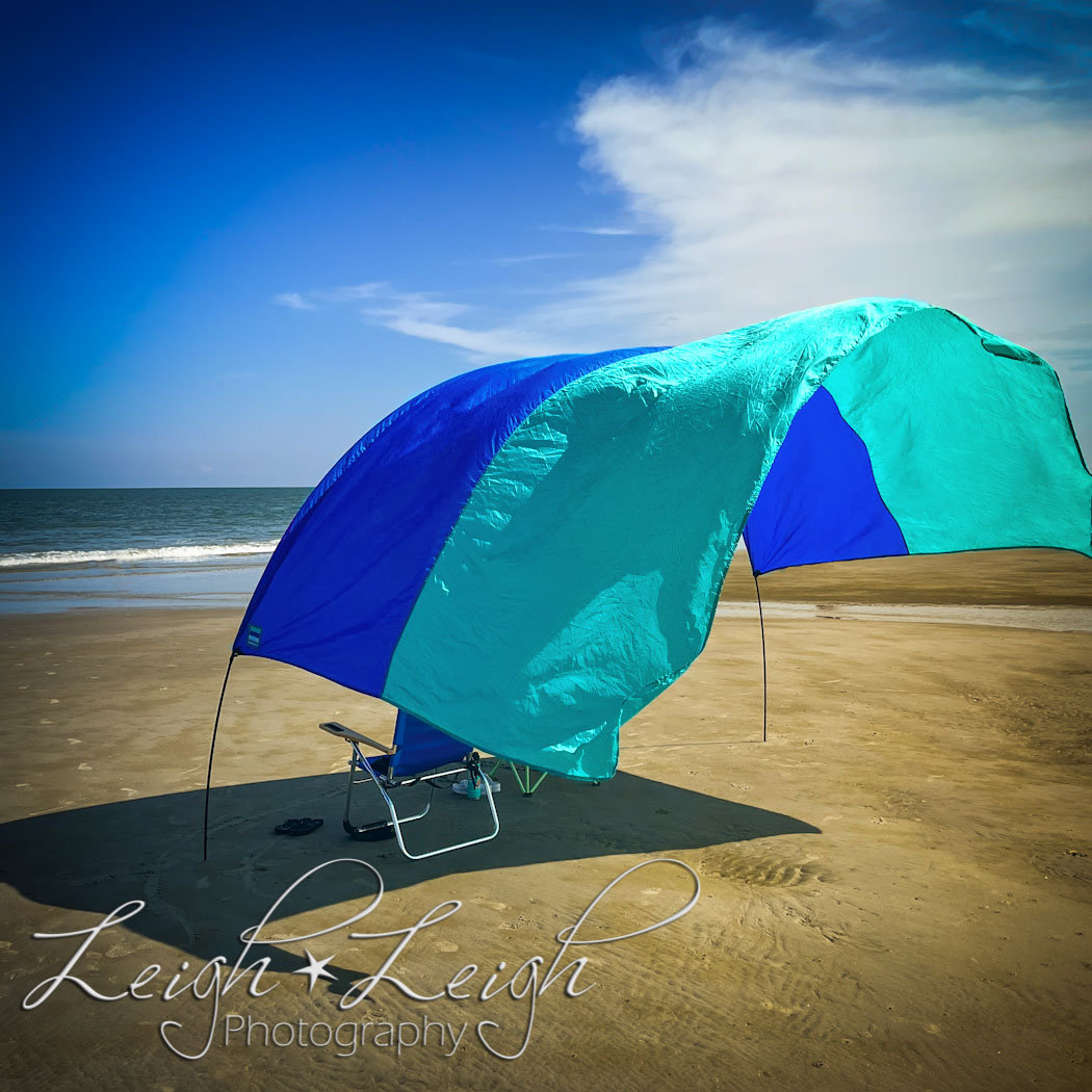 sun shade over chairs on the beach