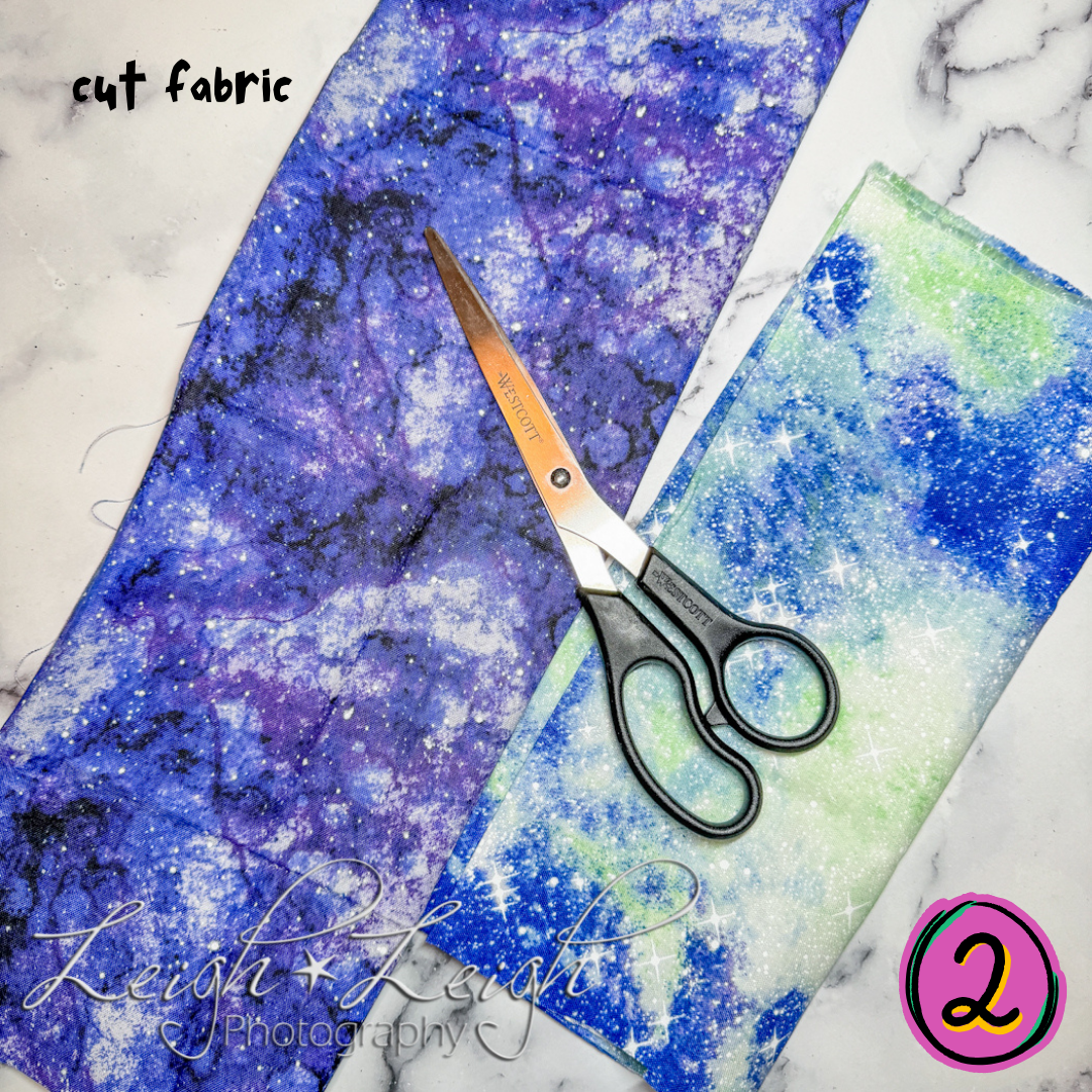 image of two pieces of fabric and a scissors