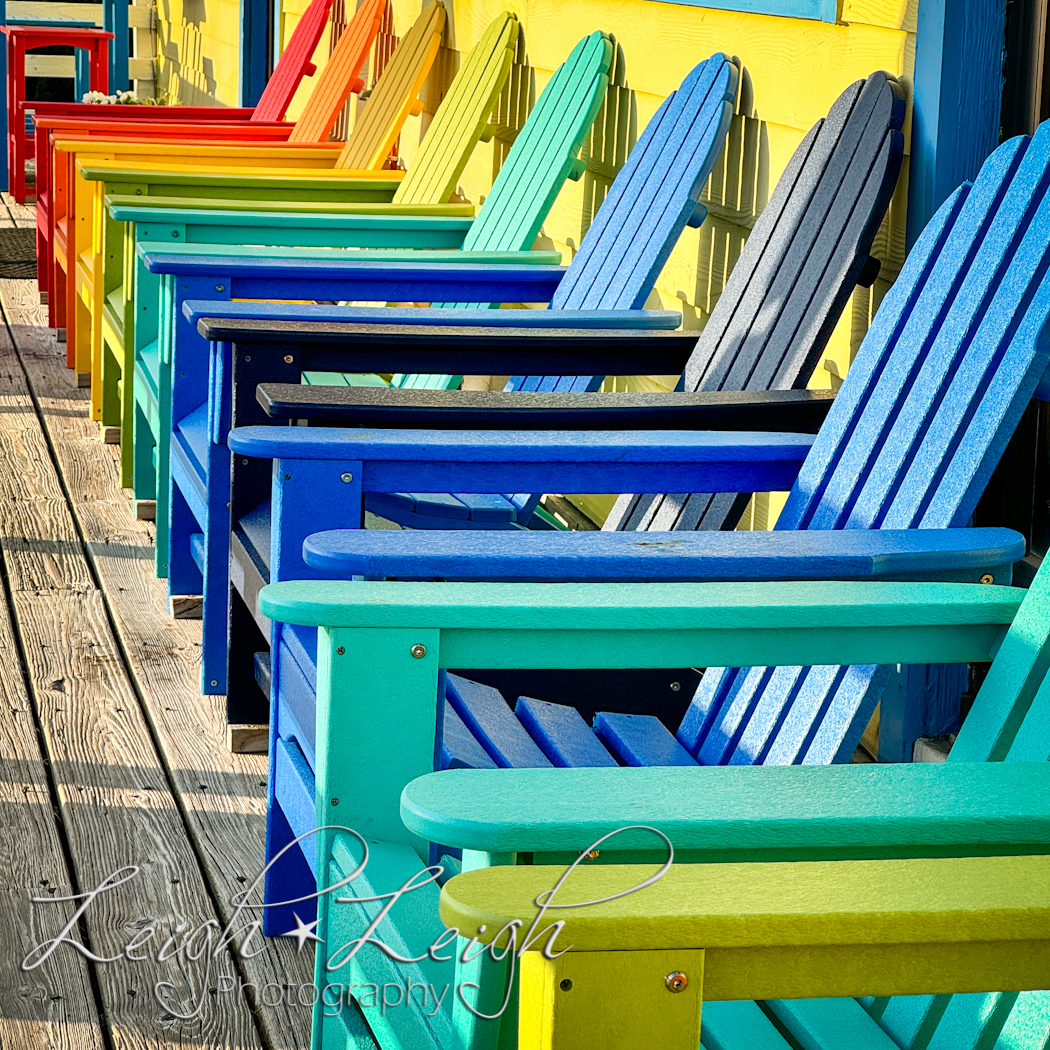 row of chairs that are in rainbow order