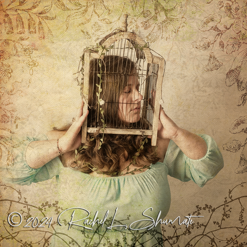 woman with birdcage on her head covered in vines