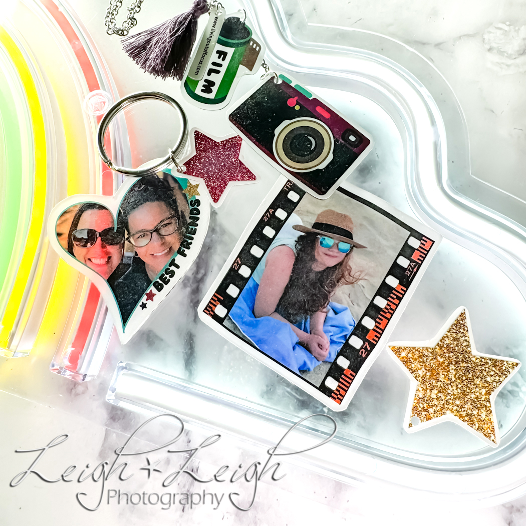 Photo Fun Shrinky Dink projects featuring a heart BFF keychain, and film frame with camera