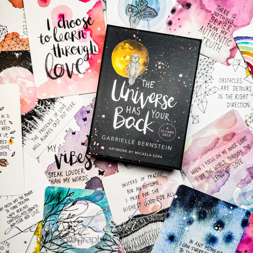 The Universe Has Your Back deck of affirmation cards with cards spread out to see artwork